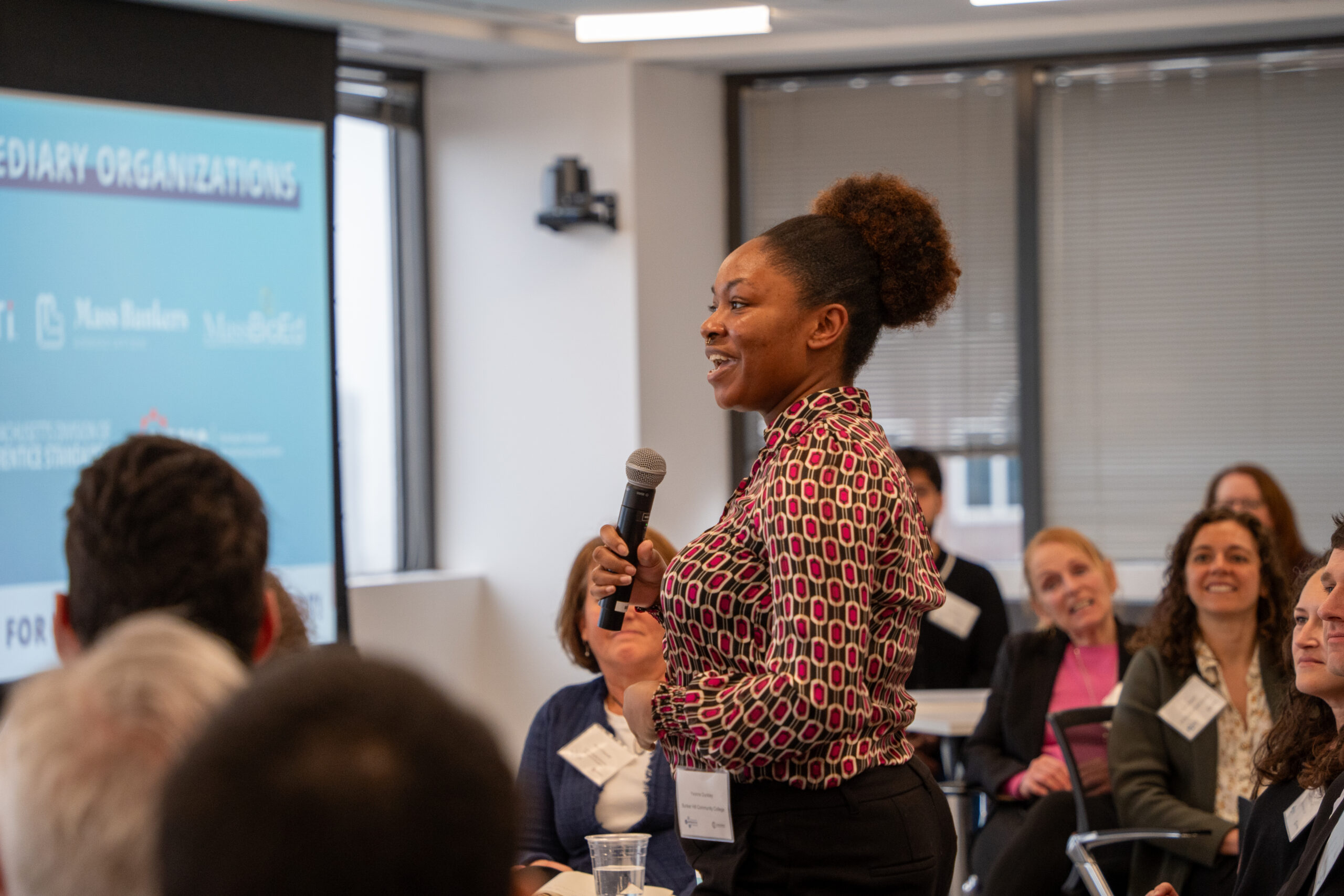 Yvonne Dunkley from Bunker Hill Community College speaks during facilitated networking session with event attendees.