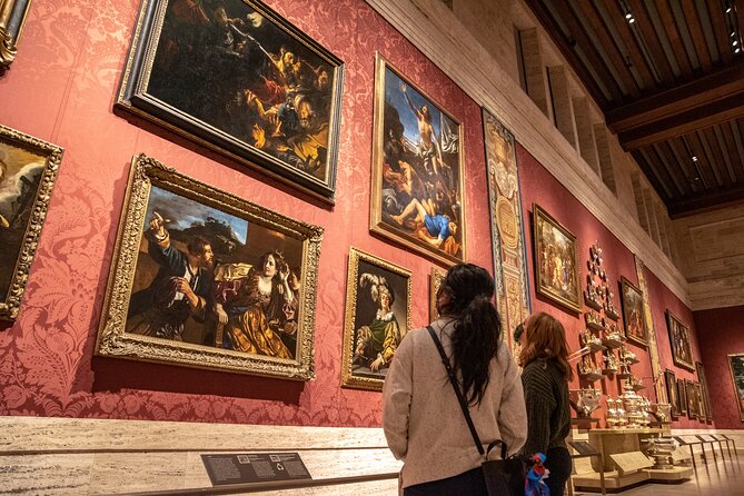 Two women looking at photos at the Museum of Fine Arts in Boston, MA.